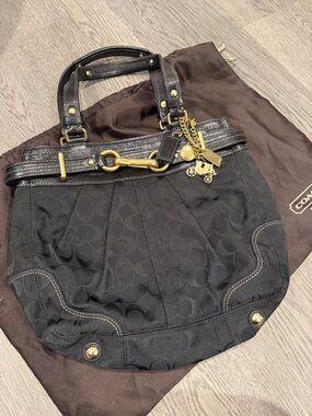 Coach Black Signature Canvas Shoulder Bag with Brass Hardware and Charm